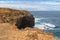 Coastal cliff at Petrified Forest Walk with deep blue sea water