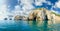 Coastal cliffs on the sea against of sky with clouds