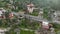 Coastal Drive: Aerial Perspective of Convertible Car Amidst Ancient Fortress and Greenery