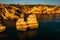 Coastal golden cliffs at sunrise in Ponta da Piedade near Lagos,Portugal.Spectacular rock formations with caves, grottoes and sea