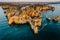 Coastal golden cliffs at sunrise in Ponta da Piedade near Lagos,Portugal.Spectacular rock formations with caves,and sea arches,