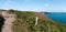 Coastal hiking trail through lilac and purple heath meadows on the Emerald Coast