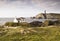 Coastal landscape with chapel and lighthouse