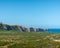 Coastal landscape with hills, trees and swamp land