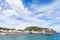 Coastal landscape of Lacco Ameno under cloudy sky