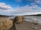 Coastal landscape at low tide with large rocks under a blue sky in Fundy Bay