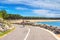 Coastal landscape - view of the Atlantic coast with a woman cyclist near the town of La Palmyre