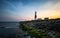 Coastal lighthouse at sunset