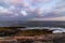 Coastal Maine rocky coast view from Pemaquid Point Lighthouse in Bristol, Maine, at sunset on a summer evening