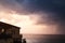 Coastal morning landscape, cloudy sky and house