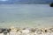 Coastal natural formation rocks on white sand beach