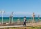 Coastal passenger road in greece woman walking sea view