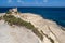 Coastal rocks and a building, island Malta