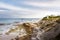 Coastal scene, waves crashing on beach