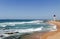 Coastal Seascape with Red and White Lighthouse Blue Sky