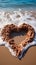 Coastal sentiment Heart drawn on beach sand, embraced by rolling wave backdrop