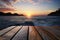 Coastal serenity Wooden table, blurred beauty of a sea sunset