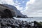 The coastal strip of the volcanic island of La Gomera, rising from the Atlantic Ocean