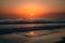 Coastal sunset captivates with horizon spanning sea waves
