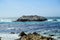 A coastal view of a california sea lion colony along the 17 mile drive outside Carmel by the Sea, which bright blue ocean scenery