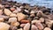 coastal view rocks towards sea with city beach