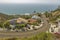 Coastal views of homes in Laguna Beach California looking downhill in residential neighborhood