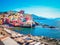 coastal village of Genoa Beach, Italy, showcasing the vibrant buildings and beachside scenery