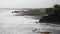 Coastal wave hitting steep cliff rock coast