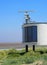 Coastguard station in fleetwood with radar antennae with crass covered dunes leading to the beach on a summers day in brig