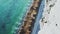 Coastline Aerial Drone of Ocean Waves Breaking on Sandy Beach by White Chalk Cliffs on Coast showing