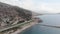 Coastline in Alanya, Turkey. Aerial drone view of seashore with car road, city and mountains