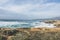 Coastline with atlantic ocean in Cascais, Portugal. Waves at the shore and rocky hills