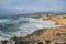 Coastline with atlantic ocean in Cascais, Portugal. Waves at the shore and rocky hills