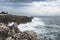 Coastline with atlantic ocean in Cascais, Portugal. Waves at the shore and rocky hills