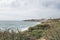 Coastline with atlantic ocean in Cascais, Portugal. Waves at the shore and rocky hills