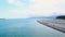 Coastline in Batumi Georgia, people sunbathing in front of Alphabetic tower