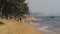 Coastline of the beach. People bathe in the sea, water rides, wave beat on the sandy shore. Thailand. Pattaya.