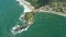 Coastline with island, beach and ocean with waves in Brazil. Aerial view of Matadeiro Beach and Ponta das Campanhas