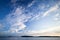 Coastline of the lake with beautiful cloudy sky