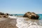 Coastline landscape with a large rock on a shore at the end of Pissouri beach, Cyprus