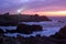 Coastline and lighthouse at dusk