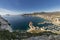 Coastline of the Mediterranean resort of Calpe, Spain with sea and yachts, lake, skyscrapers and mountain range