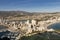 Coastline of the Mediterranean resort of Calpe, Spain with sea and yachts, lake, skyscrapers and mountain range