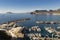 Coastline of the Mediterranean resort of Calpe, Spain with sea and yachts, lake, skyscrapers and mountain range