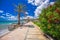 Coastline promenade with palm trees in Cogoleto town, Italian Riviera