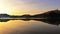 Coastline & reflections along Otago Peninsula lake