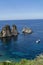 Coastline with rocks and deep blue sea near Castellamare del Golfo by entrance to natural reserve Zingaro, Sicily, Italy