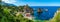 Coastline with rocks and deep blue sea near Castellamare del Golfo by entrance to natural reserve Zingaro, Sicily, Italy