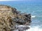 Coastline and rugged lava rocks called Dragonâ€™s Teeth and crashing waves at Makaluapuna Point near Kapalua, Maui, HI, USA