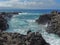 Coastline and rugged lava rocks called Dragonâ€™s Teeth and crashing waves at Makaluapuna Point near Kapalua, Maui, HI, USA